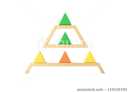 A geometric design featuring stacked triangles in various colors, arranged symmetrically within a wooden framework. 134530789