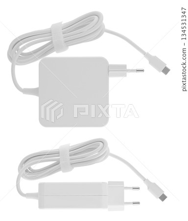 Laptop power adapter, computer spare part, on white background in insulation Laptop power adapter, computer spare part, on white background in insulation 134531347