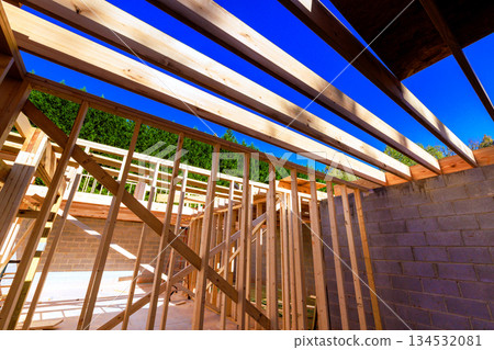 Wooden beams studs create framework new house at construction site 134532081