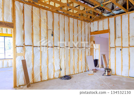 Insulated walls in structure show its ready for interior finishing construction. 134532130