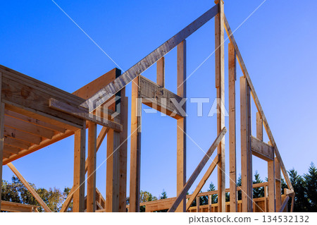 Wooden beams frames rise progress of new construction roof frame project 134532132