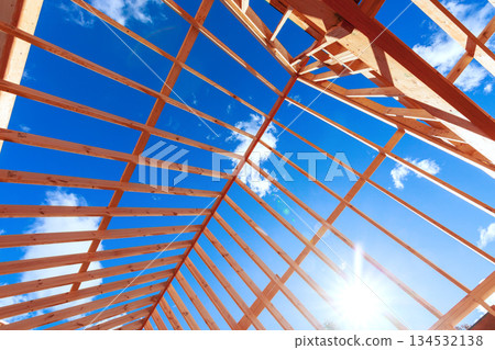 Workers build wooden roof frame beams joists roofing frame 134532138