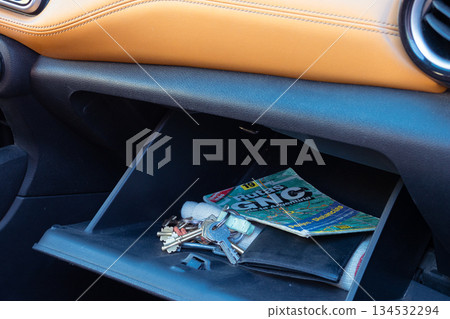 Car glove compartment organizing for safe road trip travel 134532294