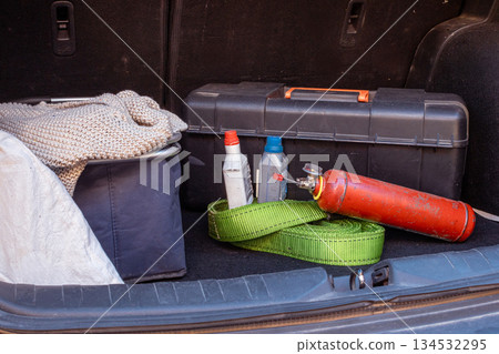 Car trunk packed with road trip safety equipment Car trunk packed with road trip safety equipment 134532295