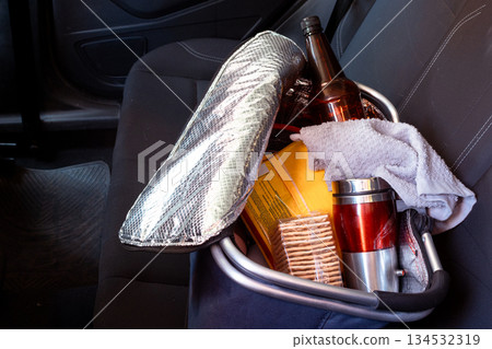 Cooler bag full of picnic items traveling in car 134532319