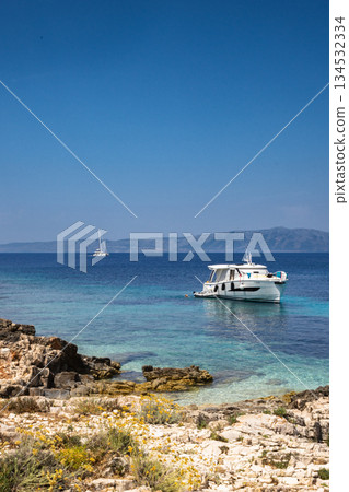 White yacht anchoring near Proizd Island beach in Croatia White yacht anchoring near Proizd Island beach in Croatia 134532334