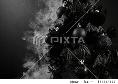 Gothic Christmas. A black Christmas tree adorned with dark ornaments and surrounded by mist 134532455