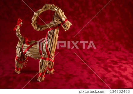 Julbock Straw Goat on Red Background Julbock Straw Goat on Red Background 134532463