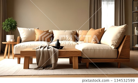 A modern living room featuring a cozy beige sectional sofa with decorative pillows, a stylish wooden table, and a plant, creating a warm and inviting space. 134532599