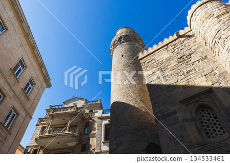 Old town steet view with walls and minaret of the Muhammad Mosque. Baku Old town steet view with walls and minaret of the Muhammad Mosque. Baku 134533461