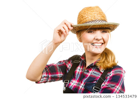 Portait smiling woman wearing sun hat and shirt 134533479
