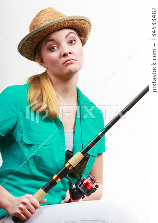 Woman with fishing rod , spinning equipment Woman with fishing rod , spinning equipment 134533482