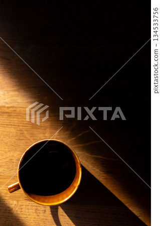 Coffee cup and table with beautiful shadows_Vertical Coffee cup and table with beautiful shadows_Vertical 134533756