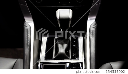 Car gear. Close up of modern car automatic gear selector or electronic shifter. Premium interior design EV car gears driving control. auto transmission modes. Automotive technology in motion driving. 134533902