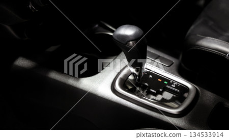 Car gear. Close up of modern car automatic gear selector or electronic shifter. Premium interior design EV car gears driving control. auto transmission modes. Automotive technology in motion driving. 134533914
