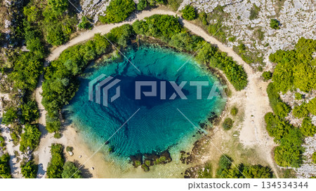 Aerial capture of Eye of the Earth Cetina Source Glavas Dinara Nature Park Croatia summer Aerial capture of Eye of the Earth Cetina Source Glavas Dinara Nature Park Croatia summer 134534344