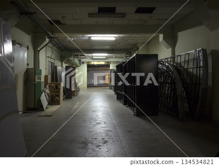 Long dark corridor in an old industrial building Long dark corridor in an old industrial building 134534821