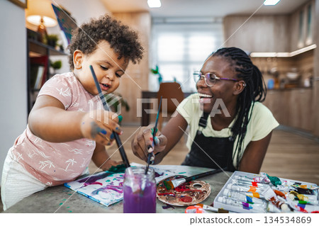 Mother and child enjoy art together indoors 134534869