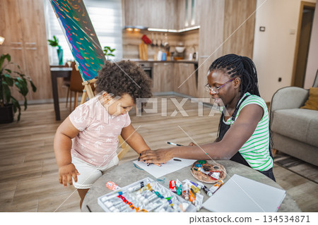 Cozy indoor painting with child in living room 134534871
