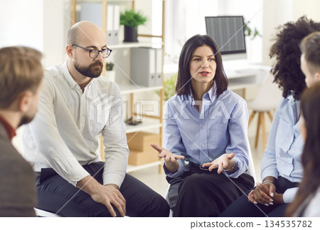 Group of business people talking on a meeting at the working place in office. Group of business people talking on a meeting at the working place in office. 134535782