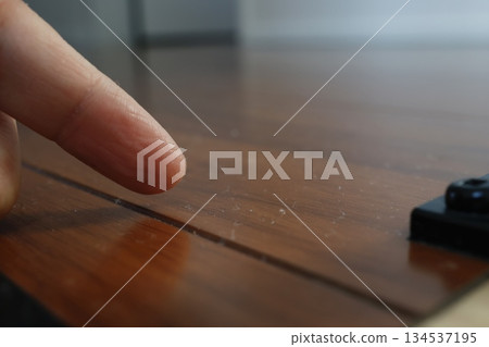 Image of indoor dust accumulated on wooden floor and the need for cleaning. Image of indoor dust accumulated on wooden floor and the need for cleaning. 134537195