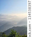 Mountain range in the morning mist at Sarangkot Observatory, Pokhara, Nepal Mountain range in the morning mist at Sarangkot Observatory, Pokhara, Nepal 134538397