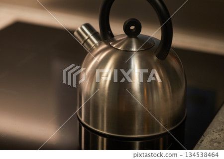 Tea pot in a stove Tea pot in a stove 134538464