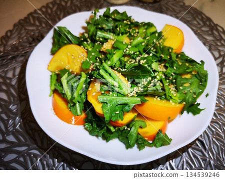 Persimmon and chrysanthemum salad 134539246