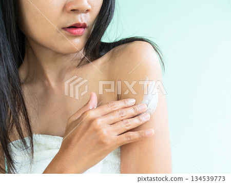 Woman Apply Lotion Skin Cream Moisture Body Care on Hand, Facial Mask Serum Medicine Injury Natural Skin Care Treatment Herb Cosmetic Sunscreen Protection, Asian Girl Black Hair and Skin tan. 134539773