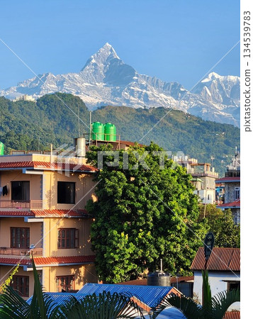 Pokhara, Nepal - View of the Himalayas and Machhapuchhre over the city Pokhara, Nepal - View of the Himalayas and Machhapuchhre over the city 134539783