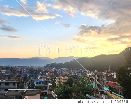 The cityscape and hills of Pokhara, Nepal at dusk 134539786