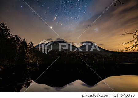 Onneto at night with shooting stars and reflections of Mt. Akan Fuji and Mt. Meakan Onneto at night with shooting stars and reflections of Mt. Akan Fuji and Mt. Meakan 134540389