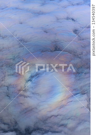 Mysterious clouds and rainbow-colored sparkles in the sky Mysterious clouds and rainbow-colored sparkles in the sky 134540397