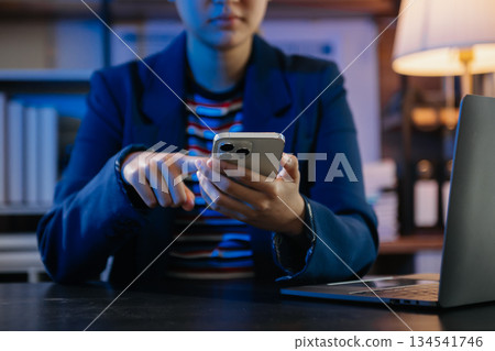 Businesswoman hand using smart phone laptop and tablet with social network Businesswoman hand using smart phone laptop and tablet with social network 134541746