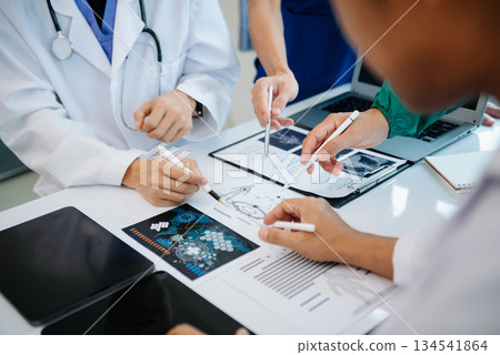 Medical technology network team meeting concept. Doctor hand working with smart phone modern digital tablet and laptop computer 134541864