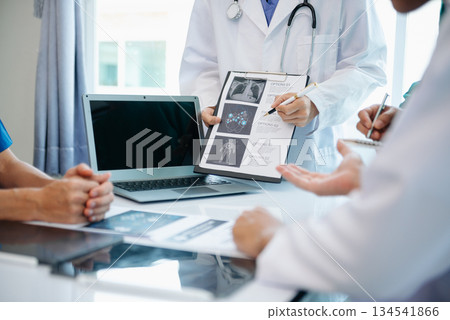 Medical technology network team meeting concept. Doctor hand working with smart phone modern digital tablet and laptop computer 134541866