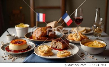 A table adorned with food and wine, featuring a French flag 134541981