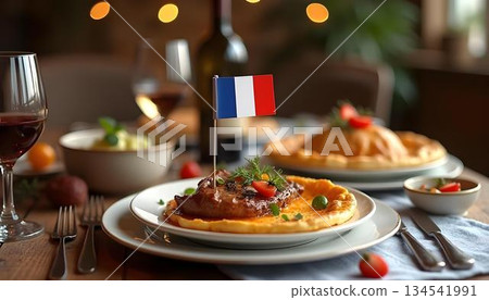 A festive table with French cuisine and wine, adorned with a French flag 134541991