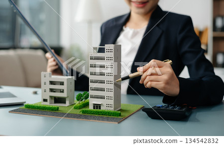 Considering buying a home, investing in real estate. Broker signs a sales agreement. agent, lease agreement, successful deal Considering buying a home, investing in real estate. Broker signs a sales agreement. agent, lease agreement, successful deal 134542832