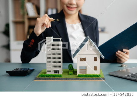 Considering buying a home, investing in real estate. Broker signs a sales agreement. agent, lease agreement, successful deal 134542833