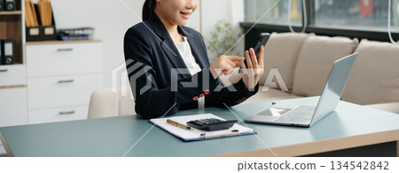 businesswoman hand working with new modern computer using on smartphone and tablet as concept businesswoman hand working with new modern computer using on smartphone and tablet as concept 134542842