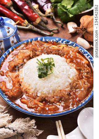 spicy sichuan-style braised beef on rice spicy sichuan-style braised beef on rice 134542862