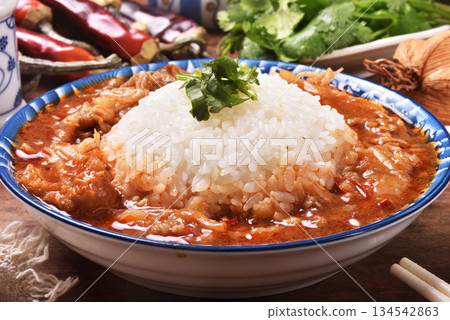 spicy sichuan-style braised beef on rice spicy sichuan-style braised beef on rice 134542863