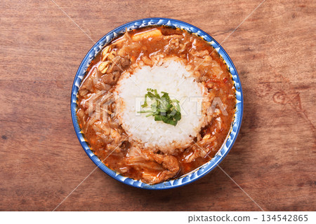 spicy sichuan-style braised beef on rice spicy sichuan-style braised beef on rice 134542865