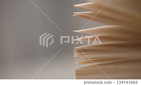 Pages of a book are shown in a close-up view on a table. Pages of a book are shown in a close-up view on a table. 134543868