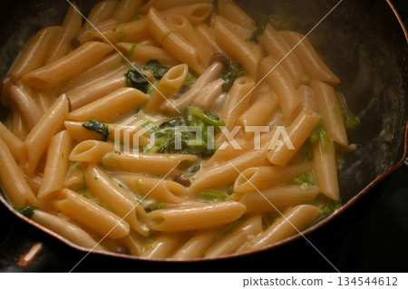 Penne cream pasta with mushrooms and spinach Penne cream pasta with mushrooms and spinach 134544612
