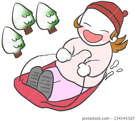 Girl sliding down a slope on a sled 134545387