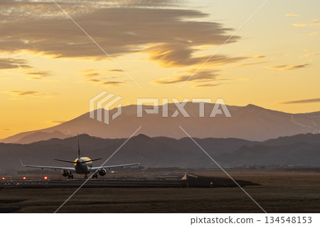 Sendai Airport at dusk, airplane taking off, Natori City, Miyagi Prefecture Sendai Airport at dusk, airplane taking off, Natori City, Miyagi Prefecture 134548153
