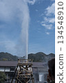 Geyser rising into the blue sky 134548910