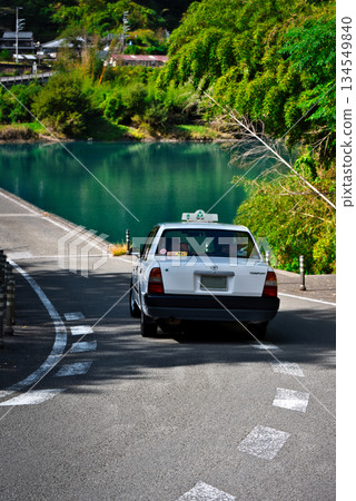 A taxi running over the Nagoeya Submerged Bridge A taxi running over the Nagoeya Submerged Bridge 134549840